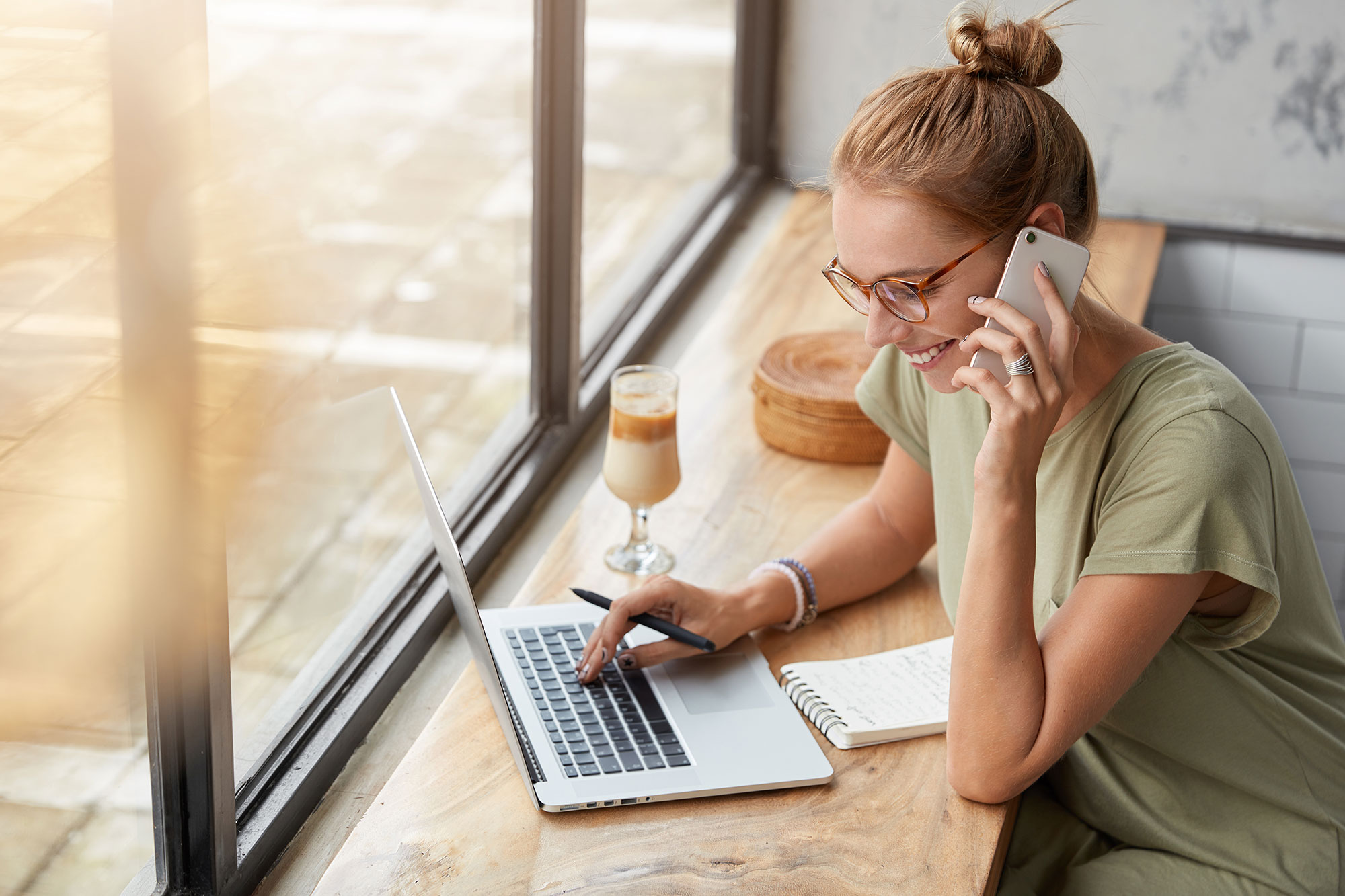 Happy woman working in a café